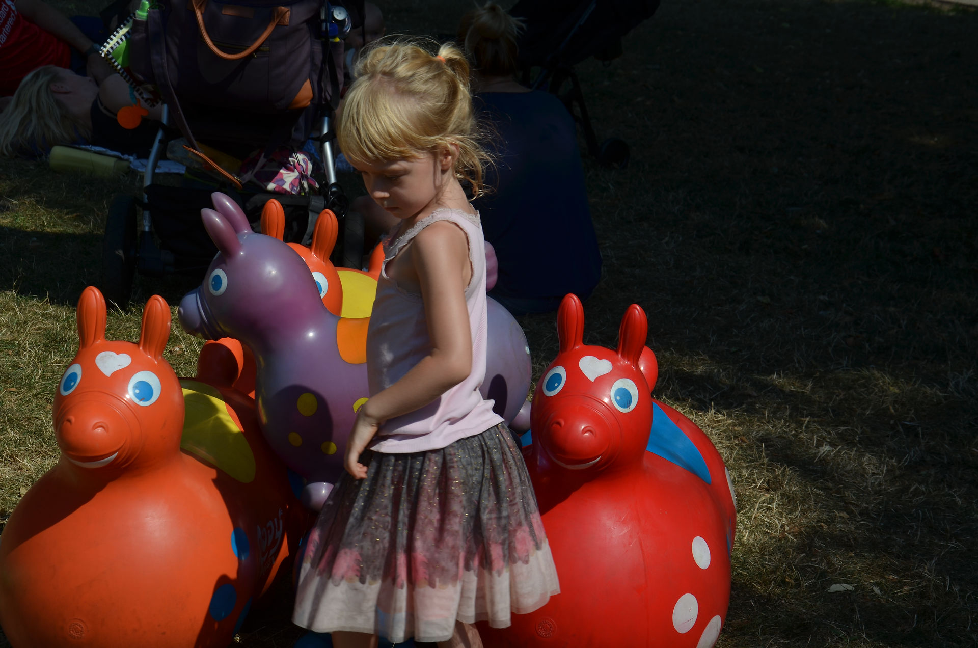Arranging toys at Out Of The Box Festival in Boston Commons