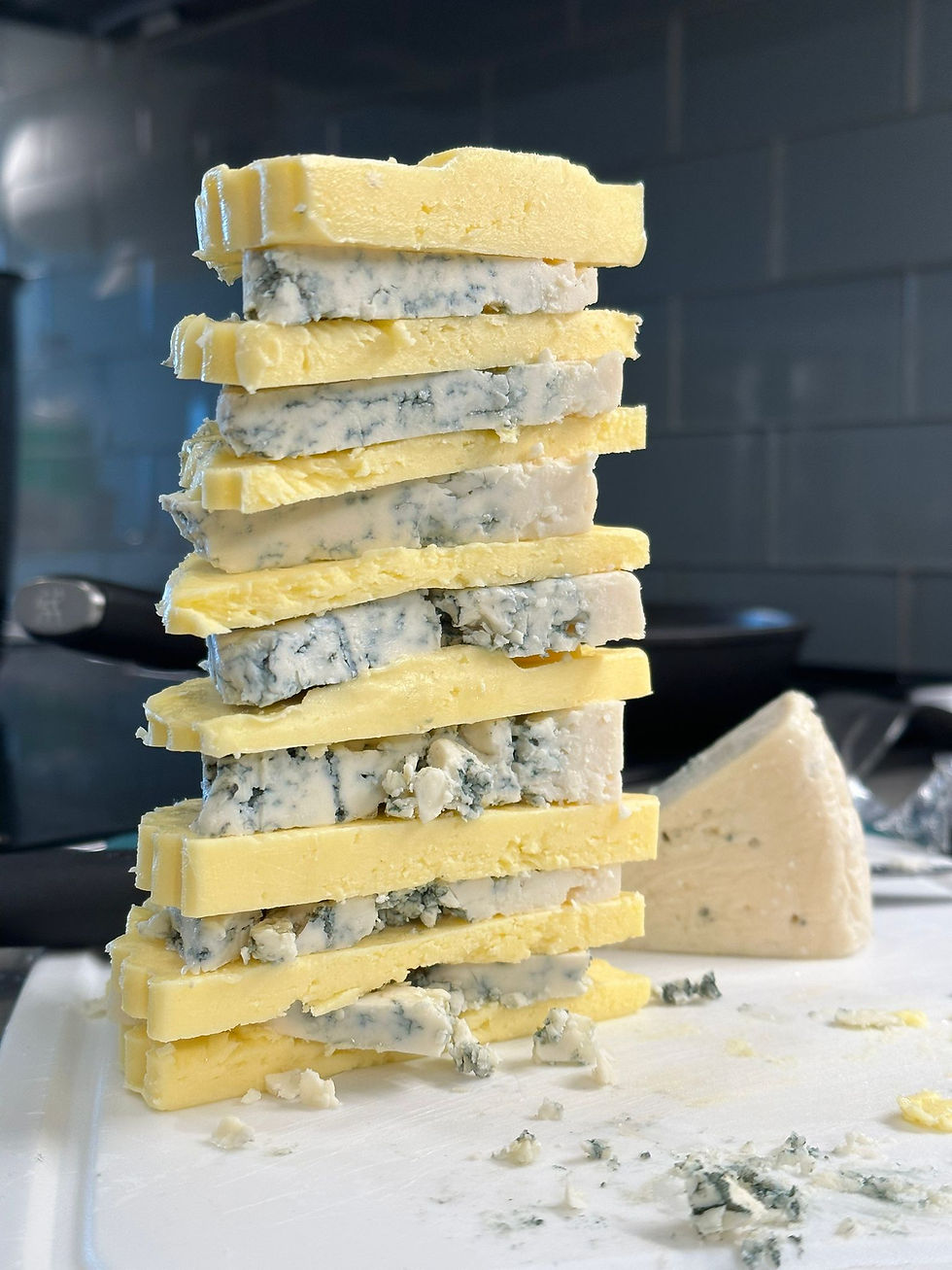 Christopher Csiszar creates a tower of cheese