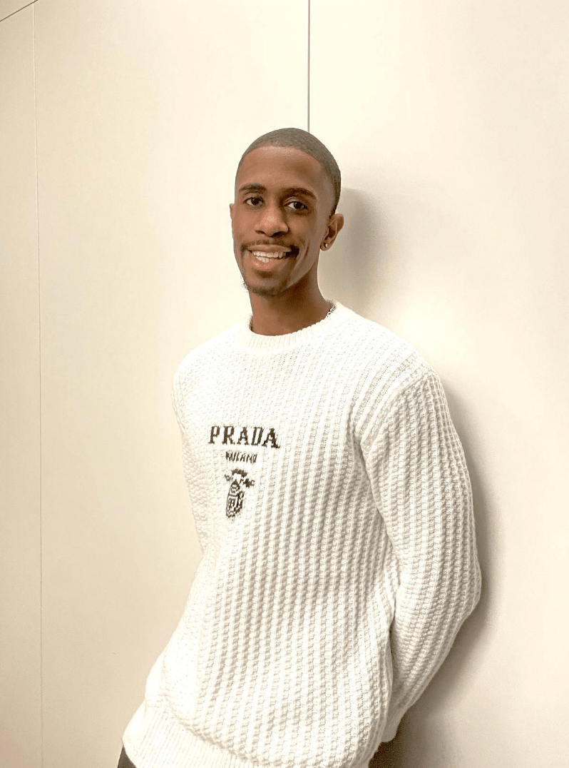 Brock Washington of Michigan leaning against a wall.