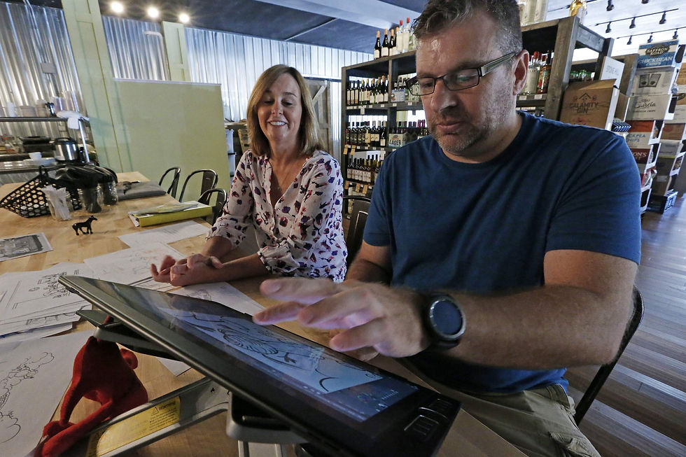 Author Tracy Schlepphorst works with her illustrator Charlie Martin at Grown-N-Gathered on Tuesday, Aug. 22, 2017. The duo are collaborating on a new book in the Emotional Belly children's book series. | H-W Photo/Jake Shane