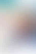 little girl sitting in a vintage truck decorated for Easter playing with a bunny rabbit