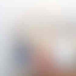 a couple with the Cincinnati skyline in the background