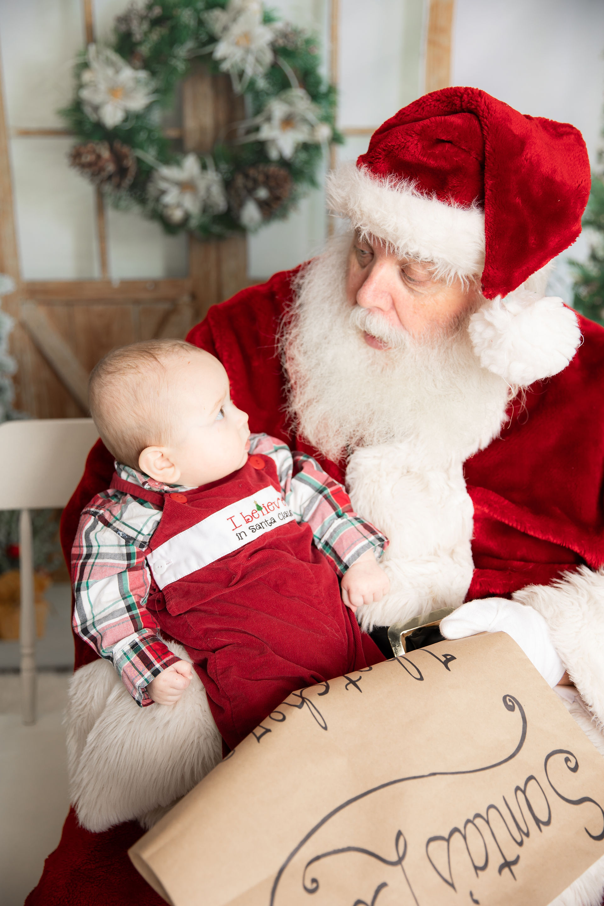 Santa Claus holding a baby boy