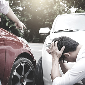 Two drivers man arguing after a car traf