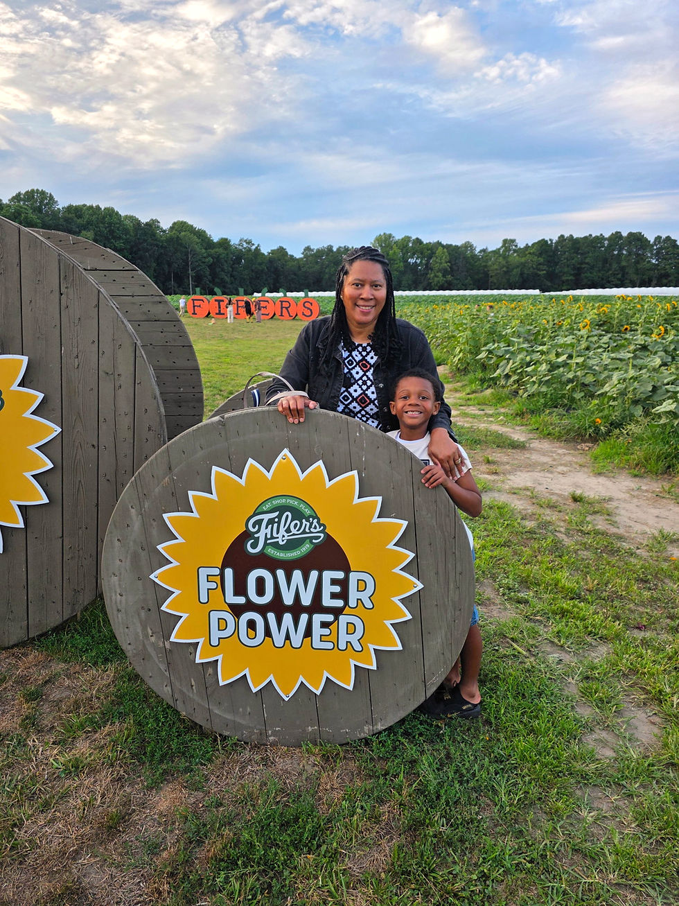 Woman and child at Fifer's Flower Power photo op.
