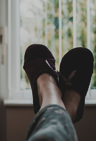 Chattanooga Home Seller crosses their ankles on the window sill. Click to learn more about selling your property with Hannah