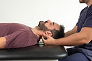 close-up-patient-receiving-neck-massage-from-physiotherapist.jpg