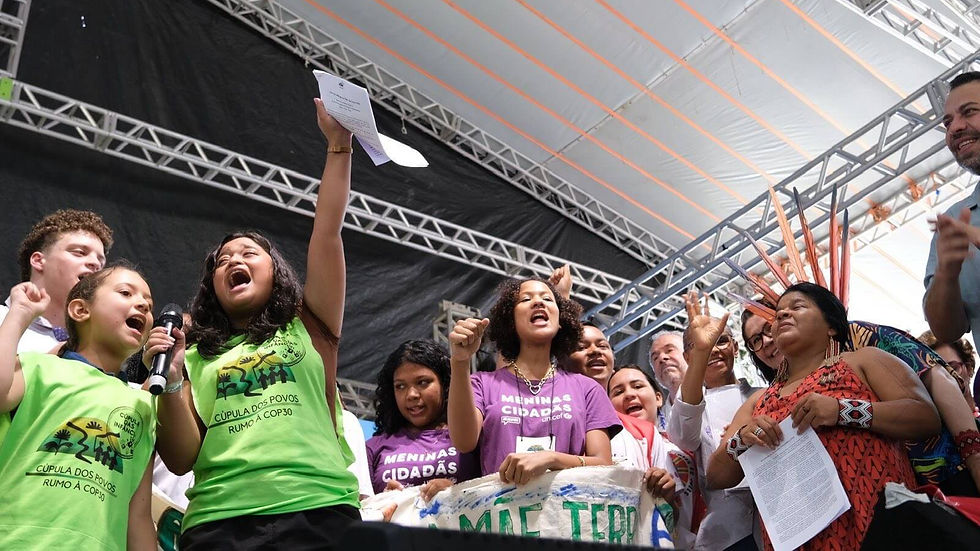 A group of youth and children deliver the "People's Summit Children's Declaration" to the COP30 Presidency and Brazilian Ministers during the closing day of the Cúpula dos Povos, or the People’s Summit, in Belém, Brazil. Photo Credit: Ashley Guardado / WECAN