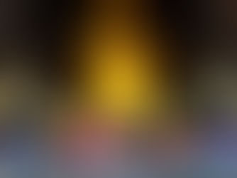 Tourists sitting inside a golden Thai temple during a Bangkok city photography tour, with warm ambient light illuminating rows of Buddha statues