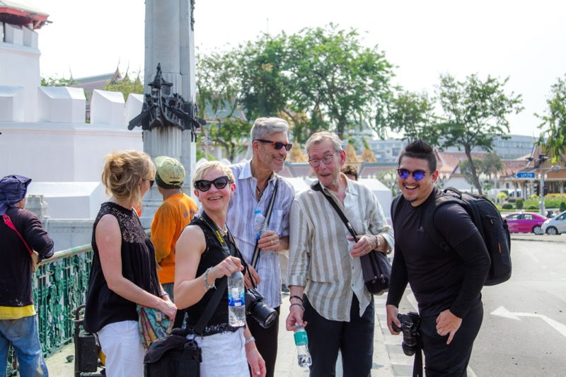 Small group of travellers with their Walk-Talk-Photo photographer on a Bangkok street