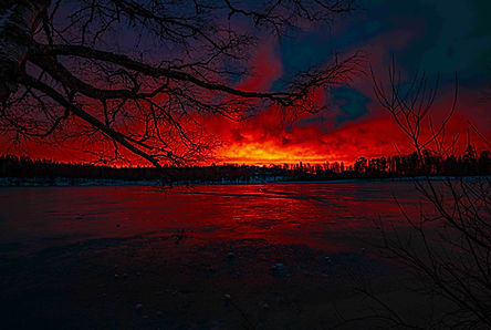 Sunset over a frozen lake in Oslo by Chris Baguley