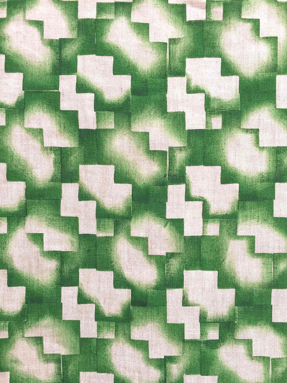 An abstract pattern with overlapping geometrical shapes in green