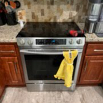 Electric stove and oven installation in kitchen