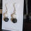 Thumbnail: White Agate Painted Dzi African Tribal Bead Black Lava Stacked Beaded Earrings