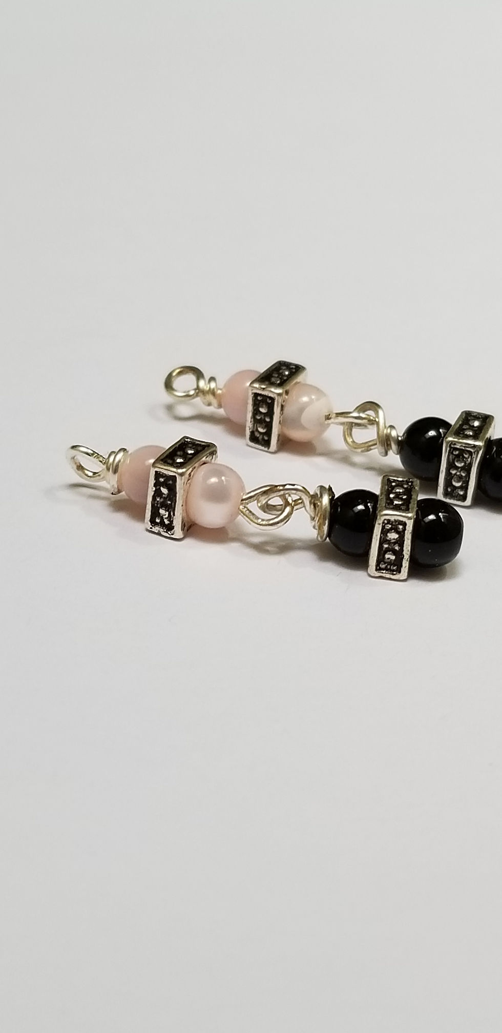 Thumbnail: Semi-Precious Pink Cat's Eye and Black Onyx Mini Dangle Earrings Elemental