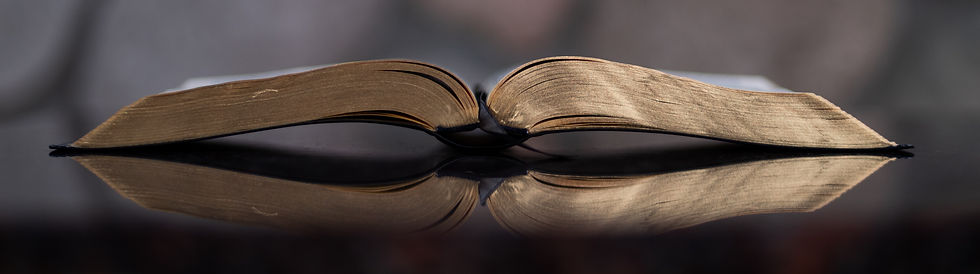open book on glass table_edited.jpg