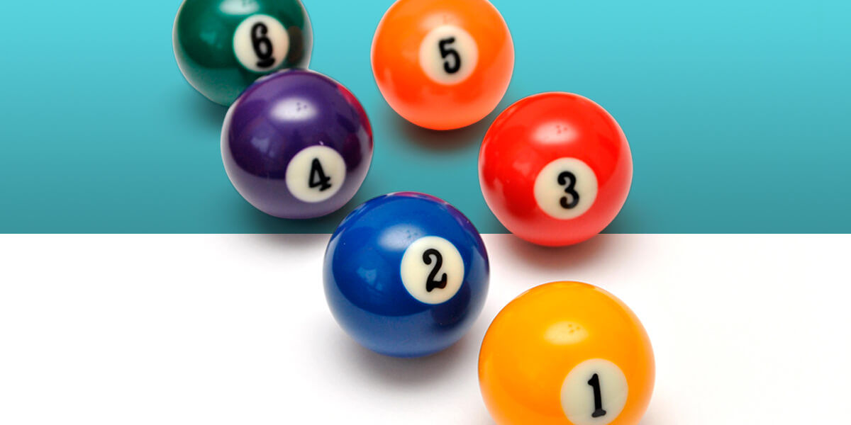 Colorful billiard balls numbered 1 to 6 on a white and aqua background, arranged in a scattered pattern. Balls are orange, blue, green, etc.