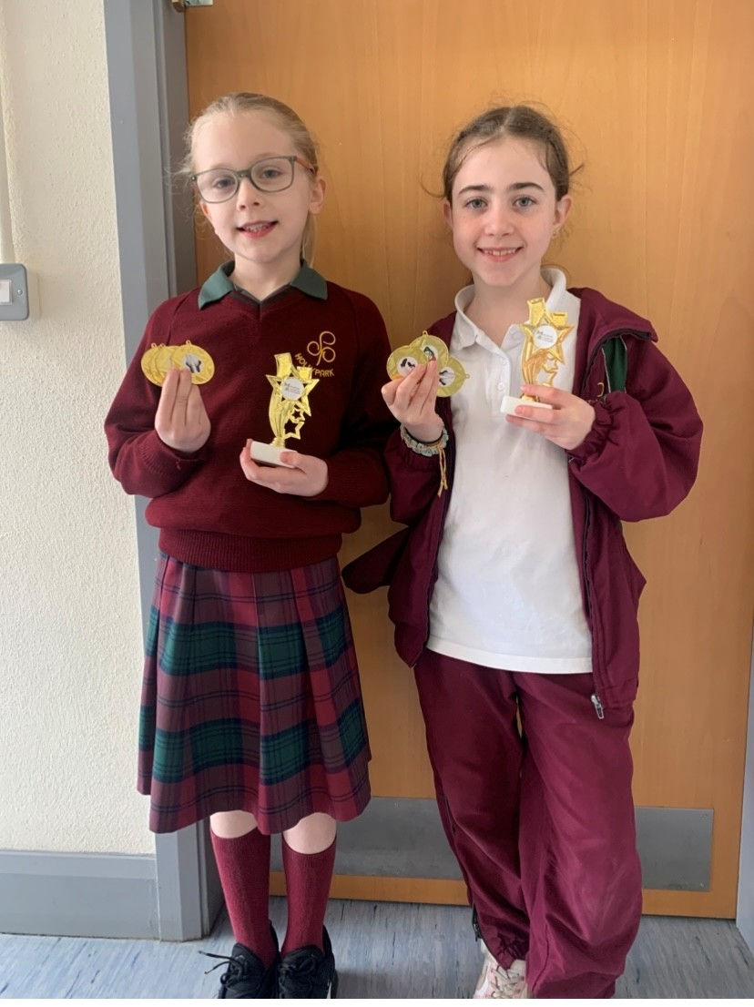 Congratulations to Sophie and Emma in Third Class, who won first place trophies along with medals at a recent Irish Dancing Feis with Marshall Academy. Well done girls!