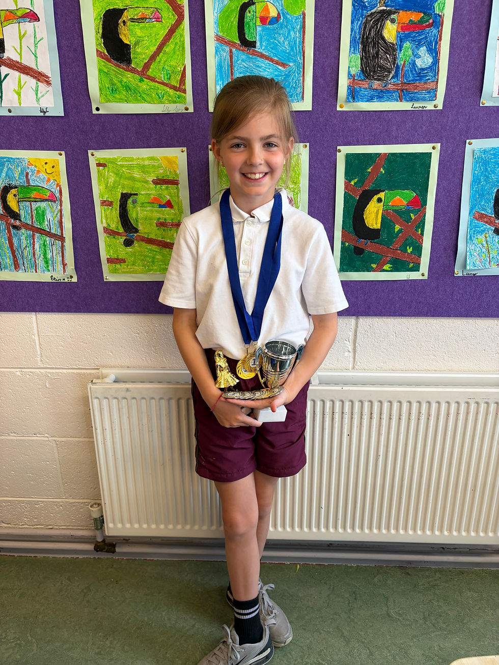 Congratulations to Fiadh in 3rd class who won medals for Irish dancing in Féile Íosagáin recently.