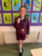 Congratulations to Emily in 3rd class who won medals for Irish dancing in Féile Íosagáin recently.