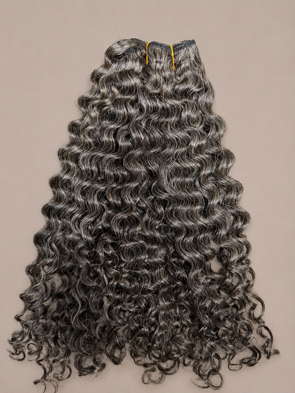 Grey exotic curly Indian hair bundles with a natural salt and pepper blend and defined curls.