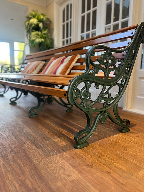 Victorian garden bench with green iron legs