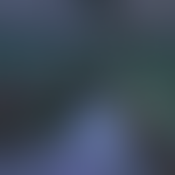 an in game screenshot of a green tiled room, vines creep up the wall, a sheet is half thrown on an old green armchair. Plants are dotted around the room, some half dead some overgrown.