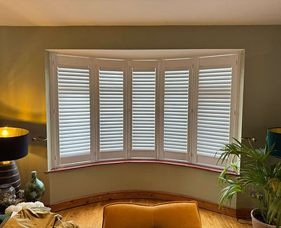 Full height hardwood shutters in a Lavenham home