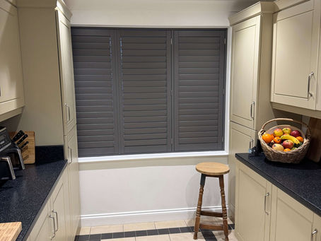 Acoustic shutters fitted in a Suffolk period property by Miavalentina Interiors showing closed hardwood panels providing noise reduction on a busy road