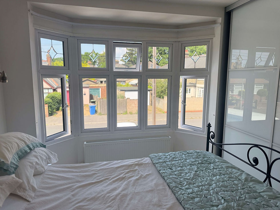 Bedroom bay window in Bury St Edmunds prepared for full height hardwood shutter installation showing the shape and depth of the bay reveal before fitting