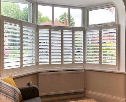 Cafe style hardwood shutters fitted in a timber-framed cottage on Lavenham High Street