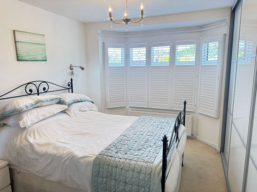 Long-lasting Paulownia hardwood shutters fitted by Miavalentina Interiors Suffolk showing quality and durability over time