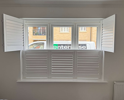 Tier-on-tier hardwood shutters for a period sash window in Lavenham Suffolk
