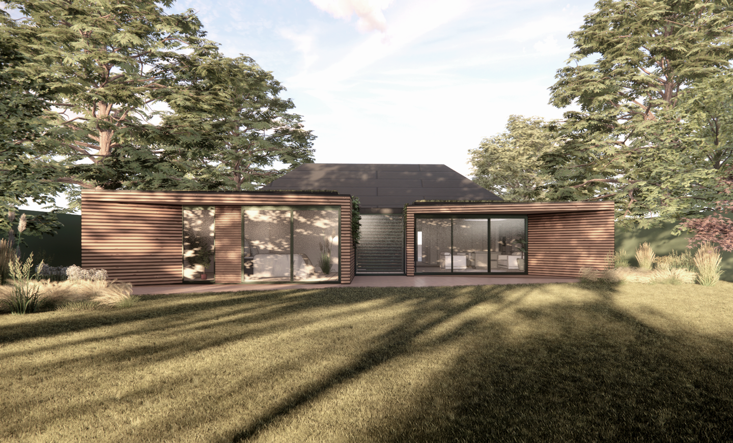 evening view of a bungalow extension with larch timber cladding, extension and renovation greyshott hampshire