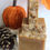Thumbnail: Stacked soaps, pumpkin, and pinecone on white background, Mocha Butter Co.