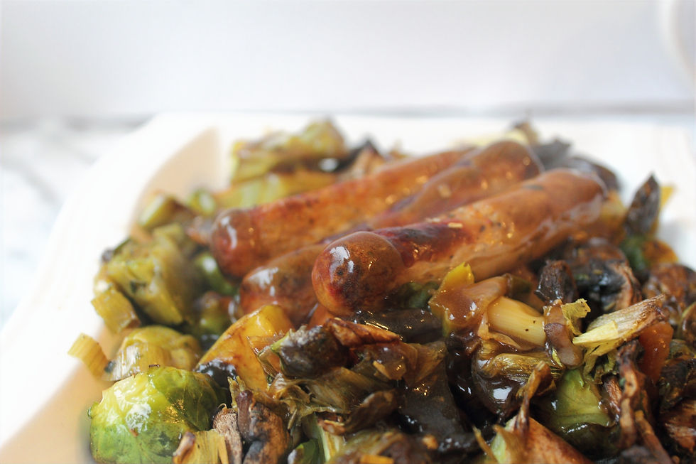 Christmas traybake with sausages, leek, Brussel sprouts, mushrooms, chestnuts and gravy