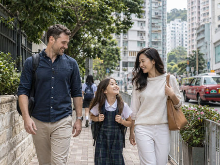 International family walking through a residential Hong Kong neighbourhood