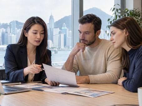 A long term Hong Kong resident discussing different immigration documents with a consultant