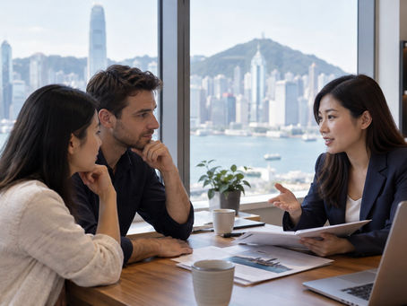 An existing Hong Kong resident discussing an investment residence route at a quiet local office