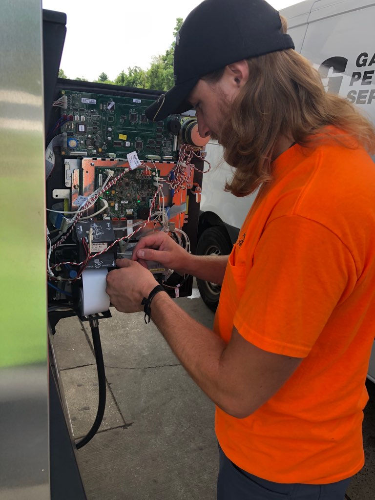 Gateway Petroleum Technology technician calibrating fuel dispensing equipment, enhancing precision and reliability in fuel measurement for petroleum services.