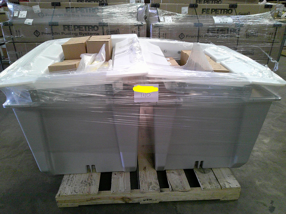 FE Petro fueling system containment sumps wrapped and palletized for project staging.