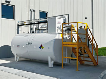 A 2,000-gallon Highland Tank aboveground storage unit for motor oil featuring a yellow safety access staircase.