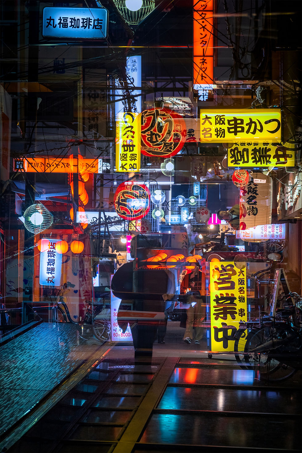 Double exposure night shot of a small alley in Osaka, Japan