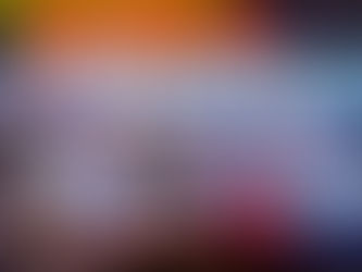 Double exposure night shot of a minibus standing near a shop with neon sign