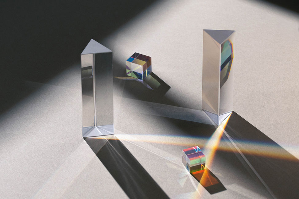 Still life photography. Dichroic glass and light prisms reflecting refracting light. Shadows and light