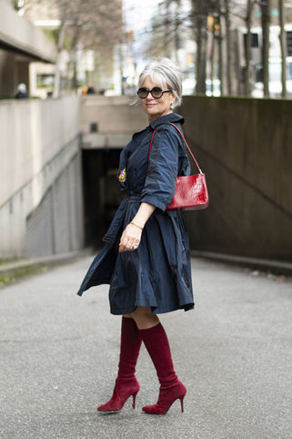 portrait photography of middle age mature female fashion model and influencer, urban city street