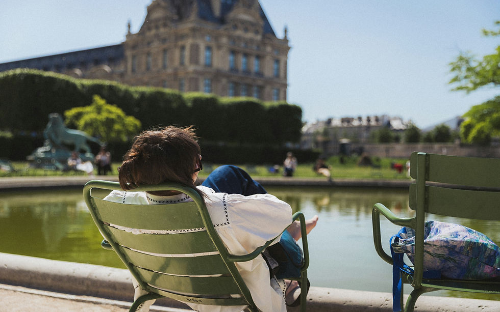 A woman relaxing in Jardin des Tuileries Paris.