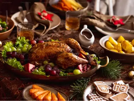 A table filled with a Christmas roast dinner