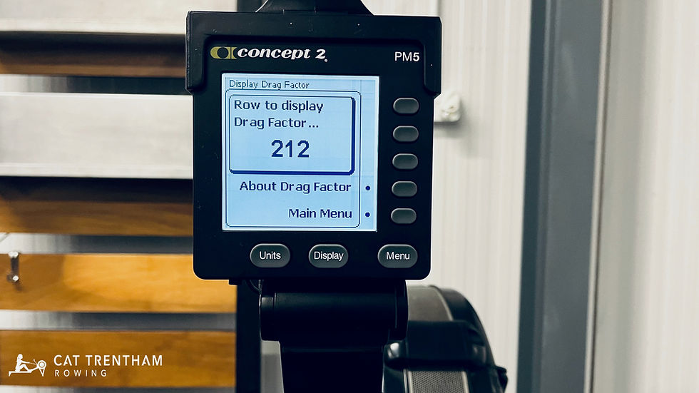 Close-up of a Concept2 rowing machine with the damper lever set to 10 and the performance monitor showing the drag factor value.