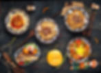 Top view on variety of different central asian cuisine dishes plov lagman mutton lamb on t